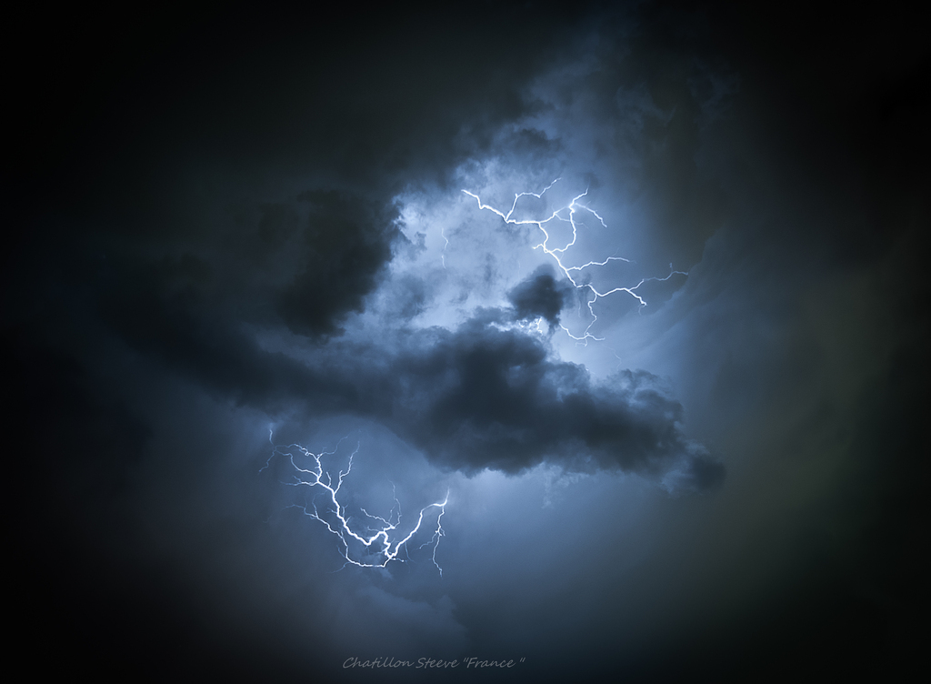 AI caption: lightning in the sky with clouds, black and white