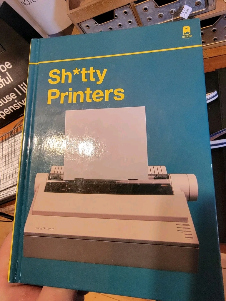 AI caption: the person is holding a book, the person is holding up a book with a shit on it, manual