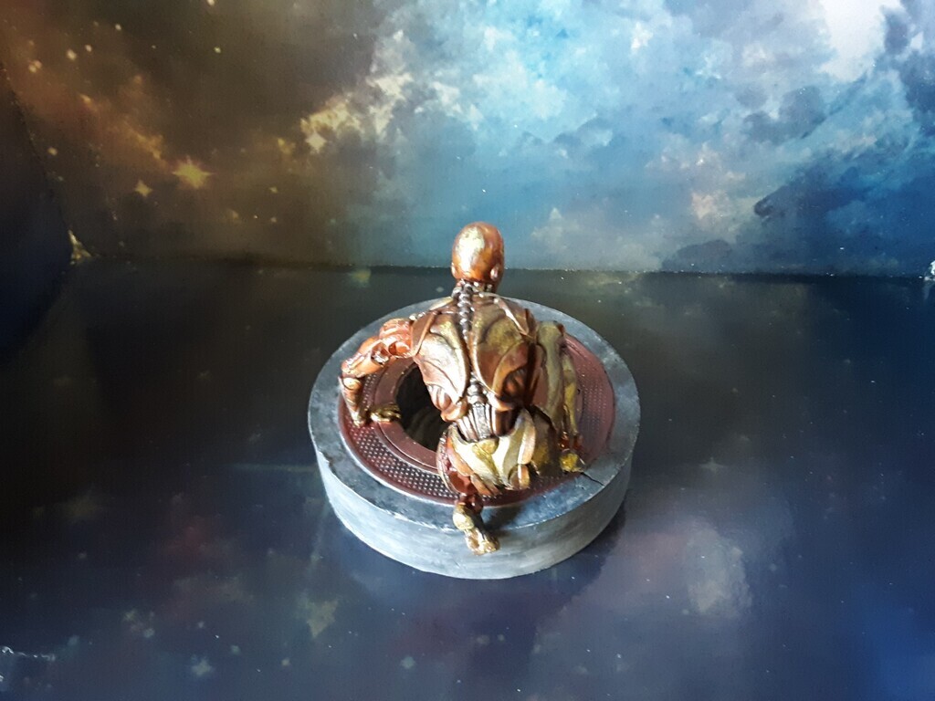 AI caption: a statue of a man sitting on a table, adobe illustrator