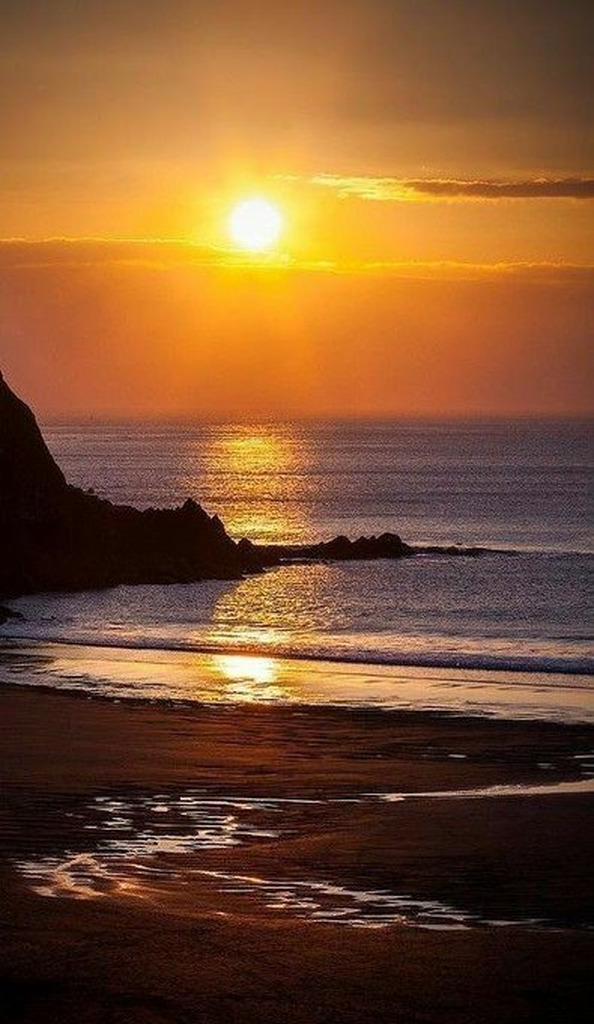 AI caption: a sunset over the ocean and beach, abstract