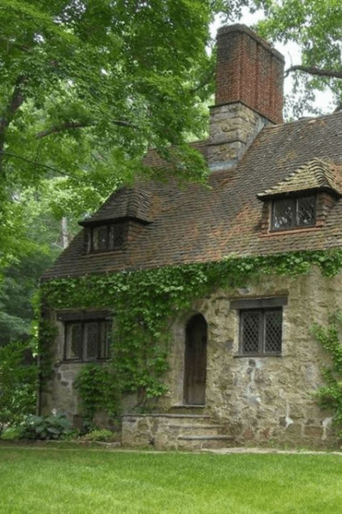 AI caption: a stone cottage with ivy growing on it, stone cottage