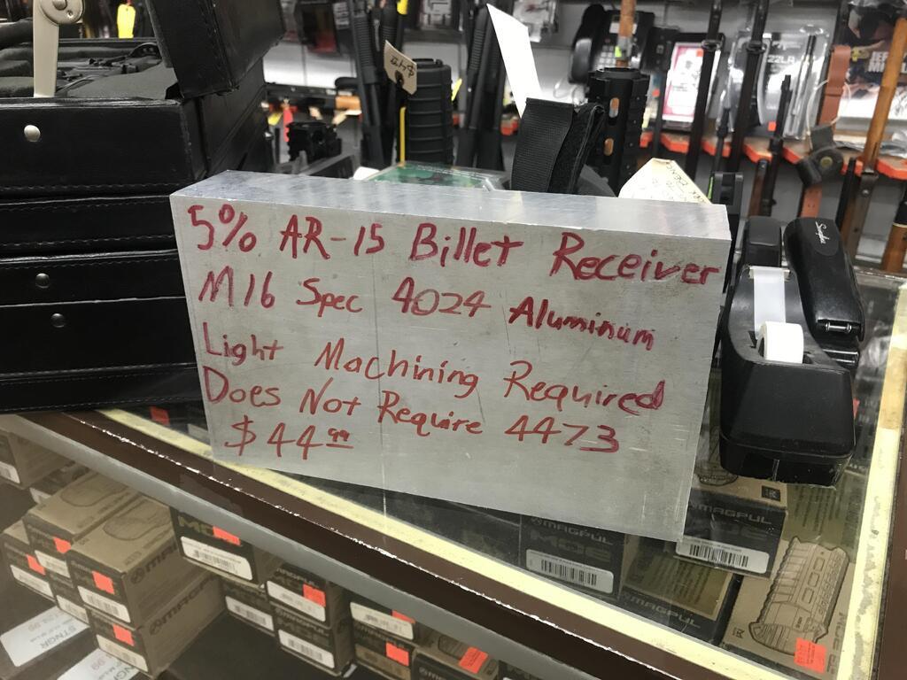 AI caption: a sign in a store that says 50 % off bullet receivers, black and white