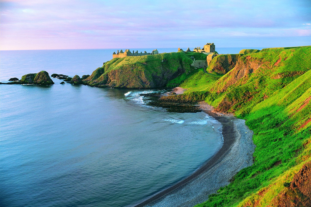 AI caption: a castle sits on a cliff overlooking the ocean, landscape