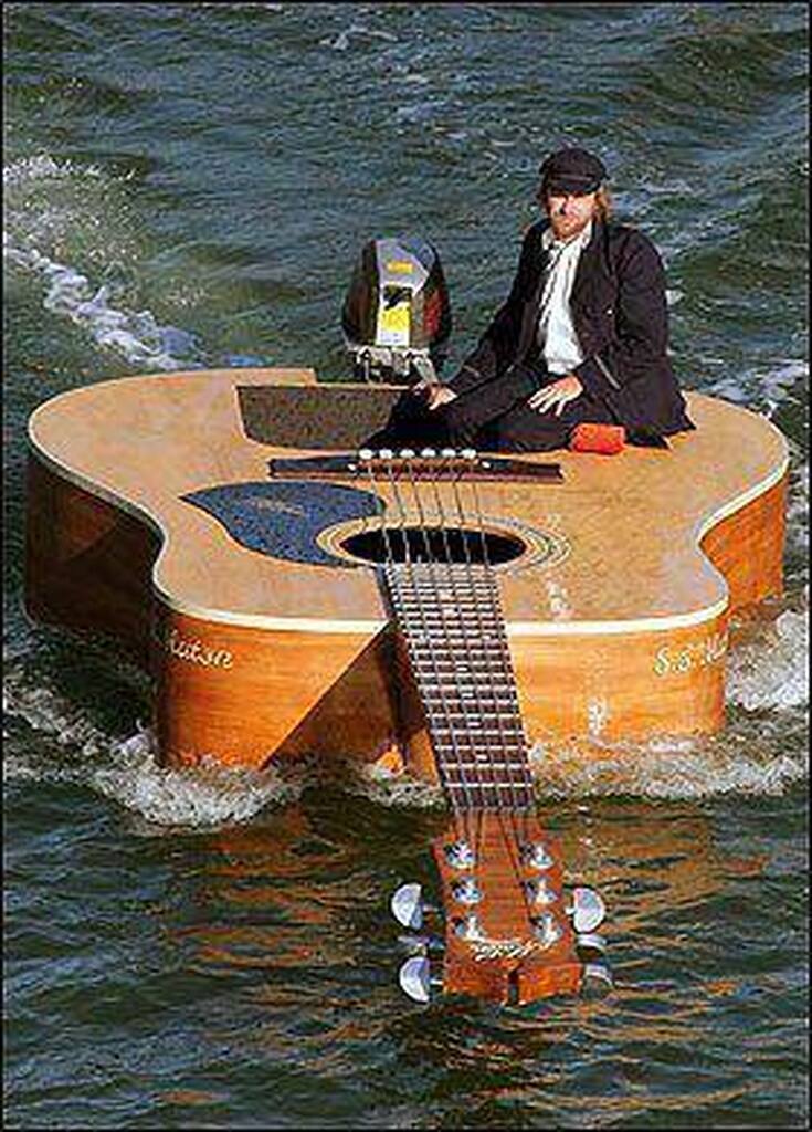 AI caption: a man sitting on a guitar floating in the water, cartoon