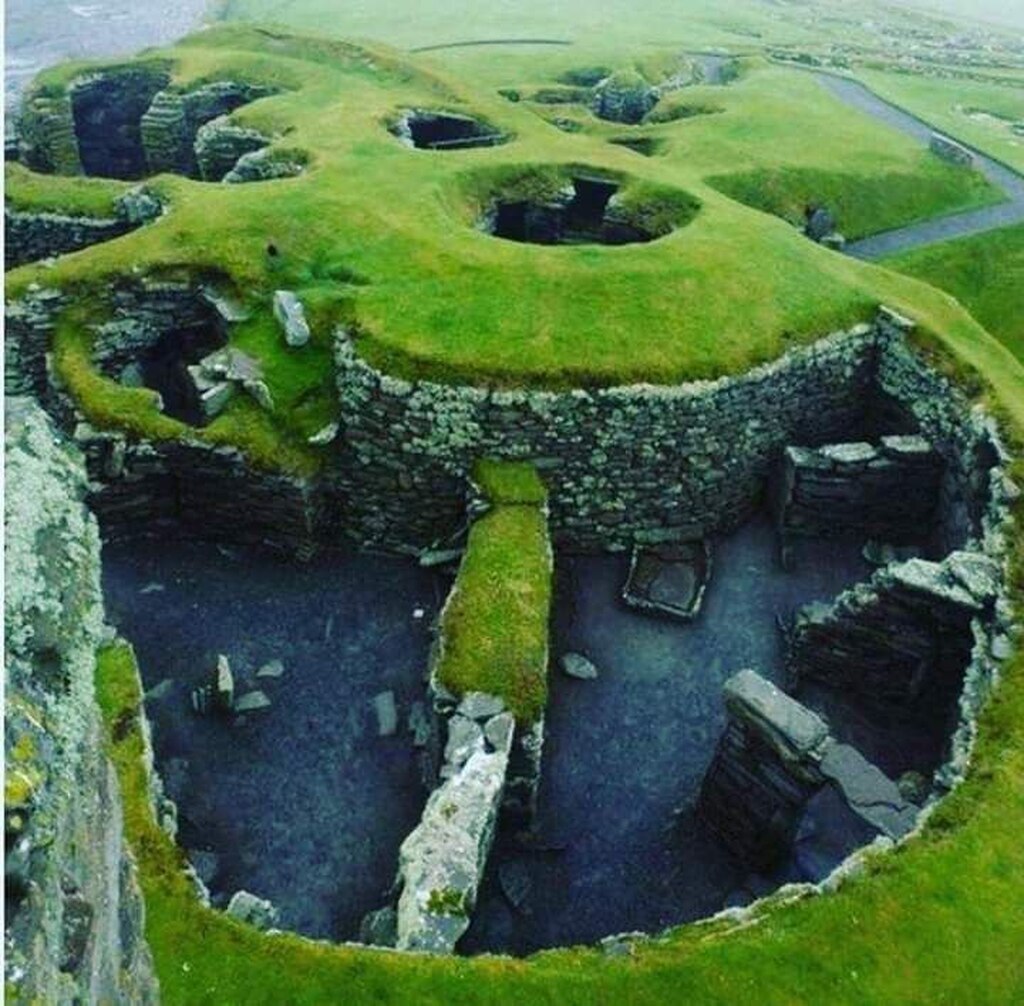 AI caption: a stone structure with a circular hole in the middle, a ruins