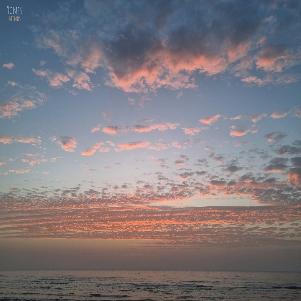 AI caption: a sunset over the ocean with clouds and water, abstract